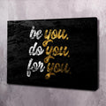 Motivational wall art canvas, 'be you' lettering in white and gold on dark background