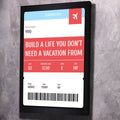 Black framed motivational boarding pass wall art with quote, gate info, and barcode
