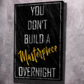 Black motivational wall art with 'You don't build a Masterpiece overnight' text, black frame