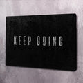 Black motivational wall art canvas with 'KEEP GOING' lettering