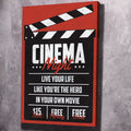 Red and black cinema-themed wall art with clapperboard and 'Cinema Night' text