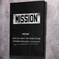 Black portrait canvas wall art with “MISSION” headline and noun quote text