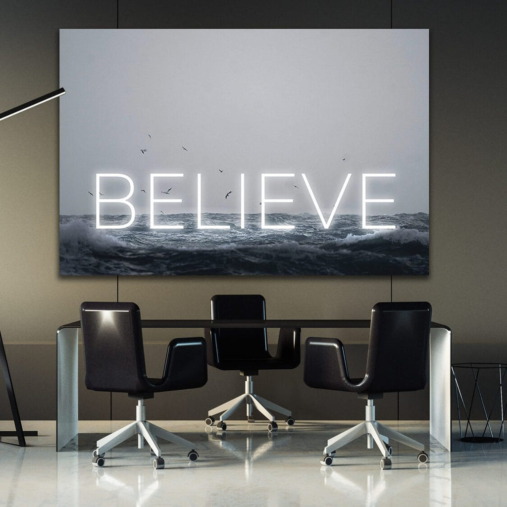 Motivational wall art canvas with glowing 'BELIEVE' over ocean waves