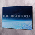 Landscape canvas wall art with blue sky/ocean and text 'PLAN FOR A MIRACLE'.