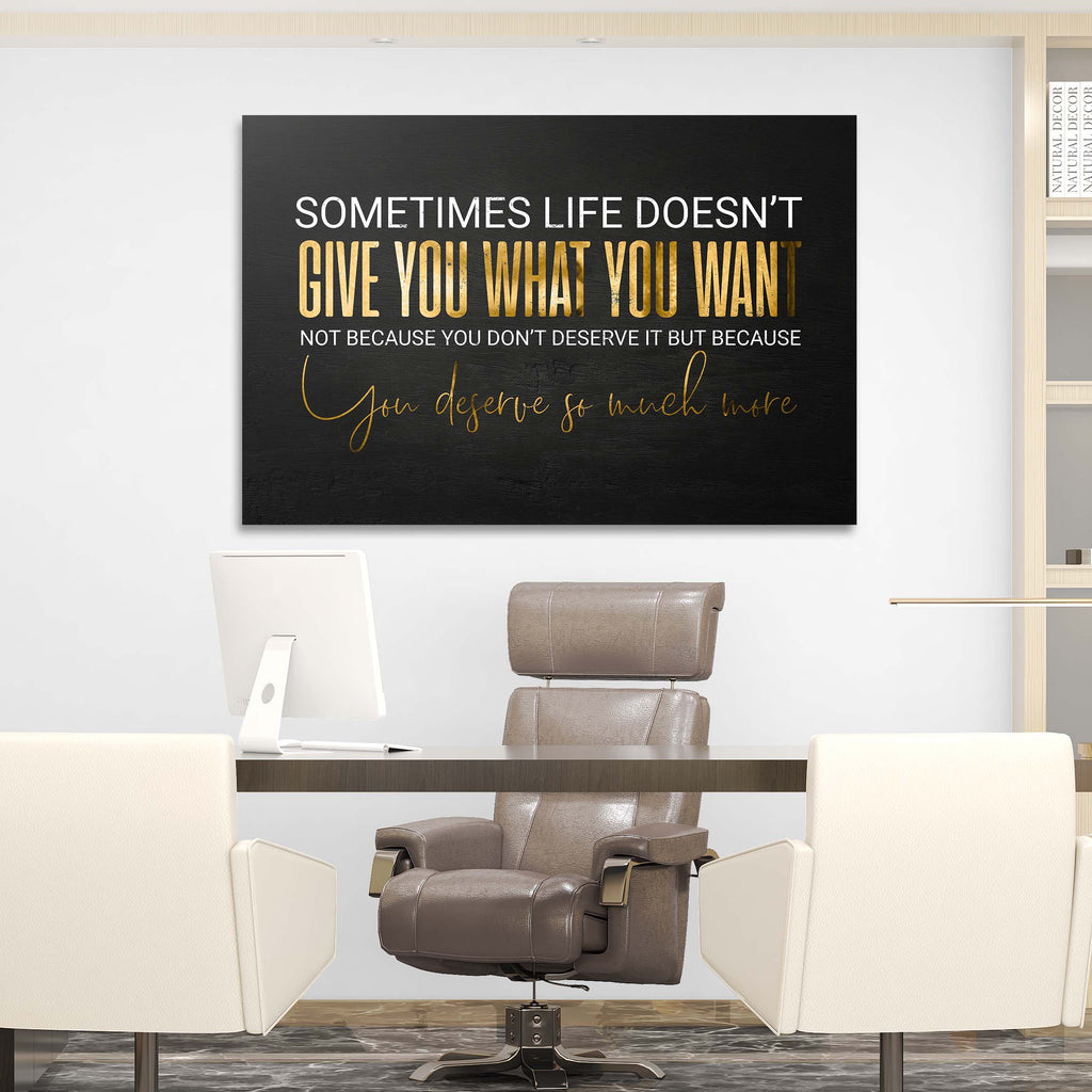 Black canvas wall art with gold and white quote and cursive signature, wall mounted