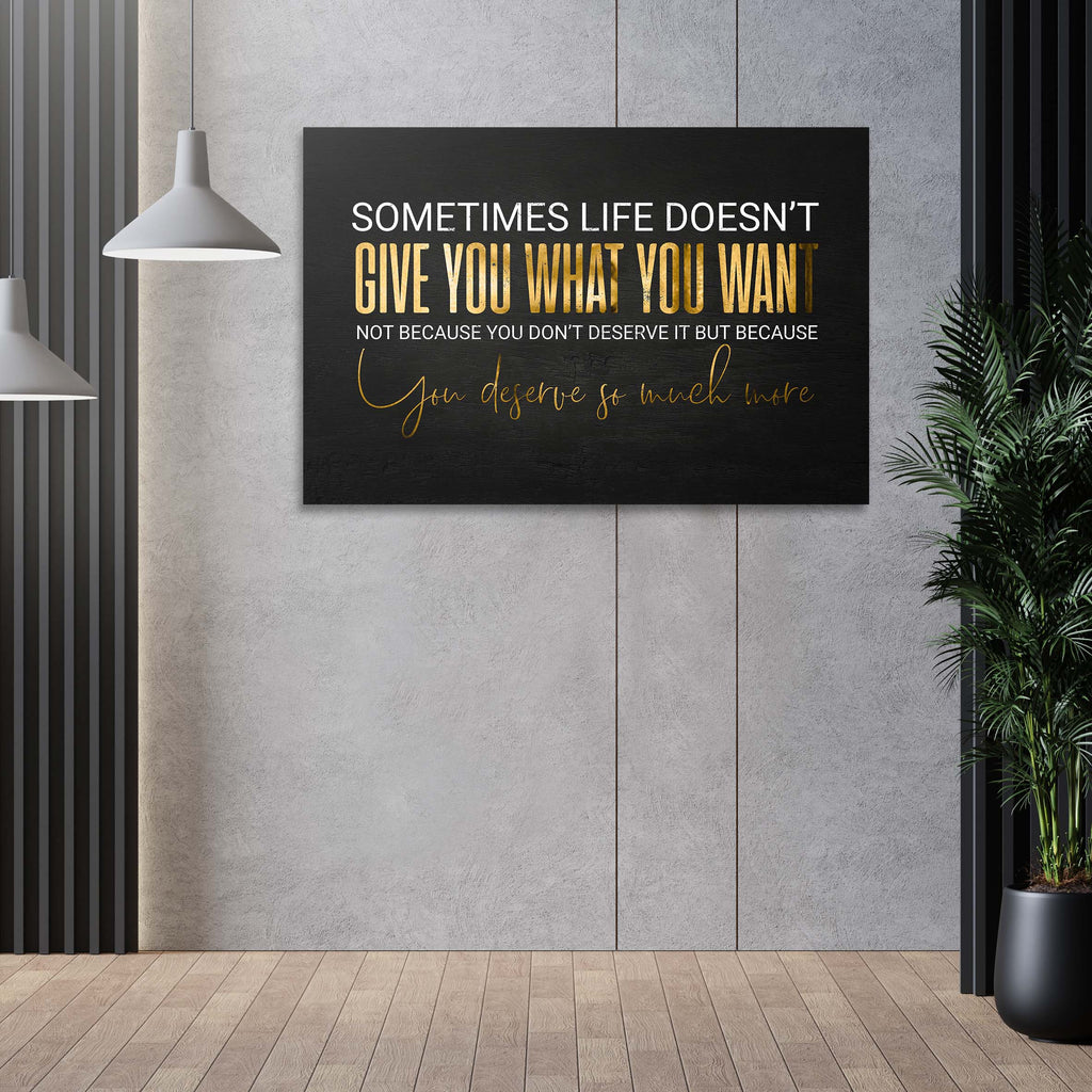 Black canvas wall art with gold and white quote and cursive signature, landscape