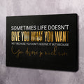 Black canvas wall art with gold and white quote and cursive signature, landscape