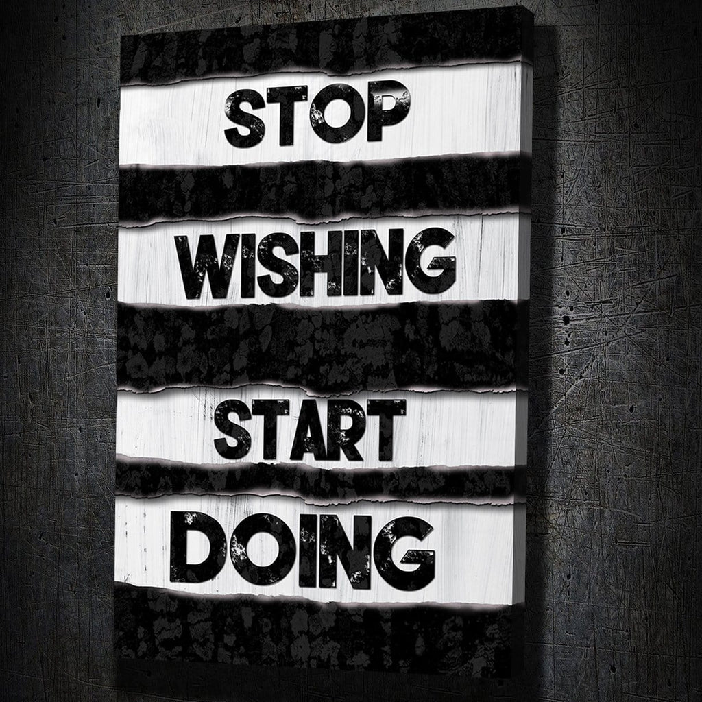 Motivational wall art reading STOP WISHING START DOING, white text on black stripes