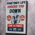 Motivational wall art canvas with boxer hands graphic and bold text, portrait layout